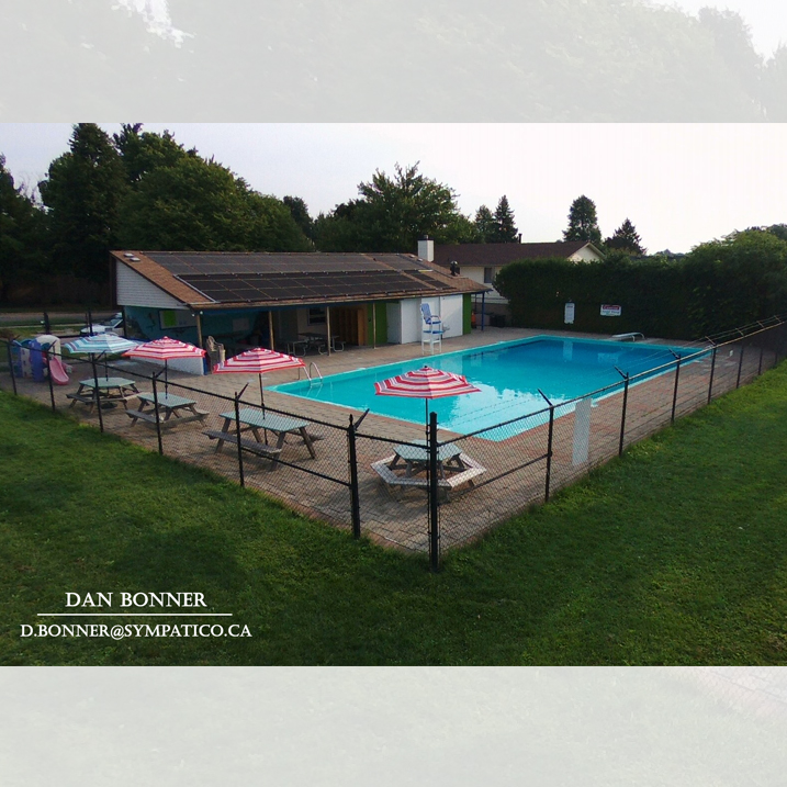 forest edge community pool drone image by dan bonner