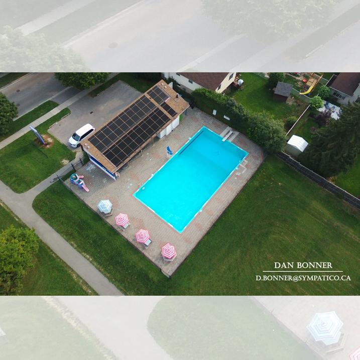 forest edge community pool drone image by dan bonner