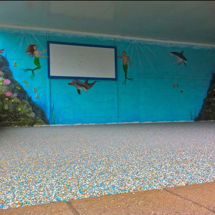 forest edge community pool covered shelter area with ocean mural