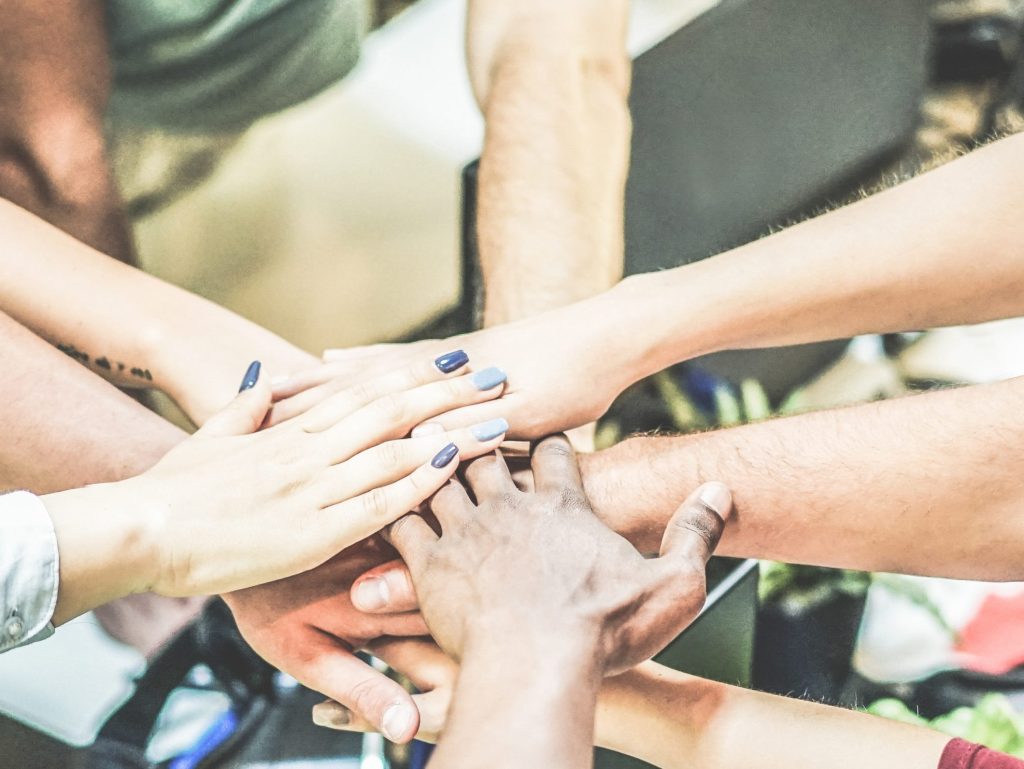 Team stacking hands together